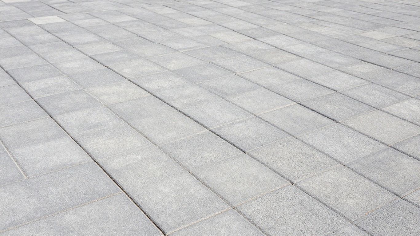 Close-up of grey interlock pavers showing clean joint lines and consistent sizing