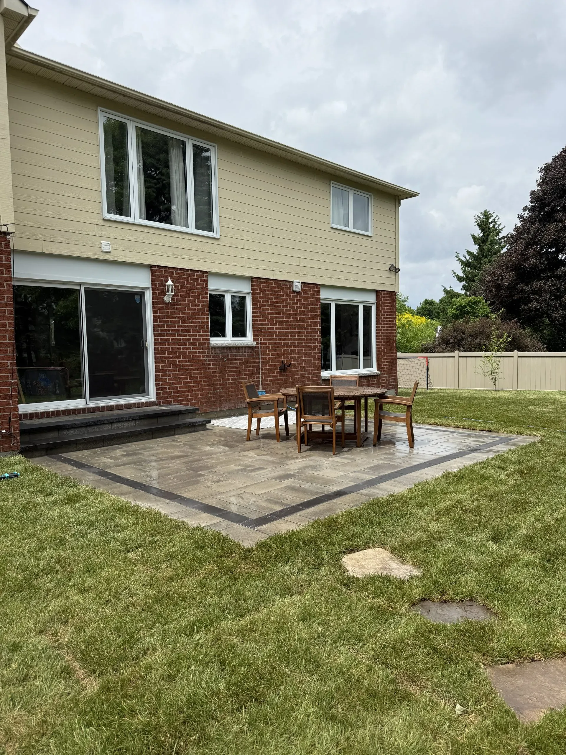 Ottawa side yard transformed with grading, topsoil and sod installation.
